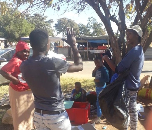 The Environment Club talking to people about recycling