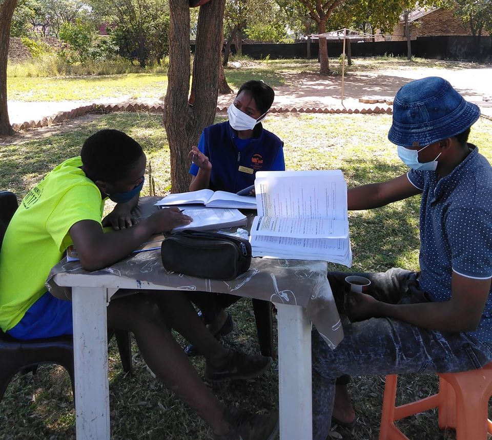Sister Grace helping learners with studies through Lockdown