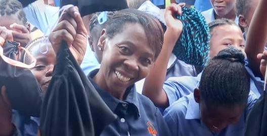 Sister Grace donating packs of eco-sanitary pads in schools fo the Waterberg