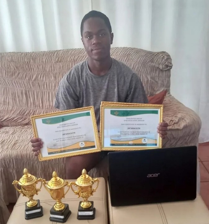 Elton with his recent certificates