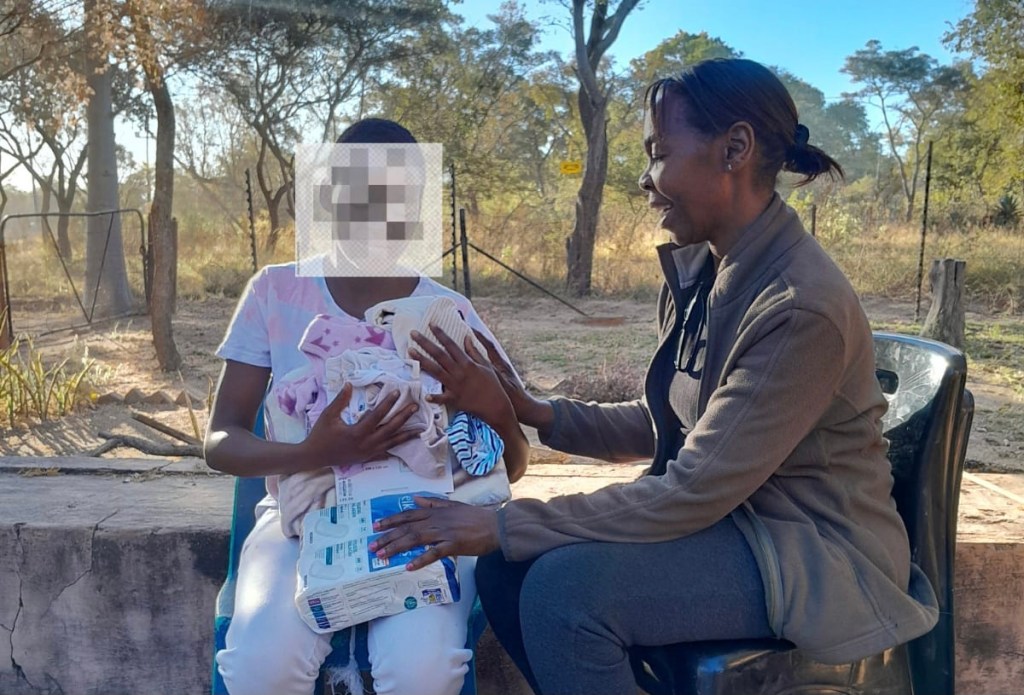 A school-age Mum receiving guidance and support